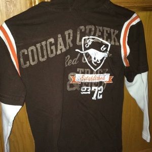 Brown long sleeve with white and orange accents